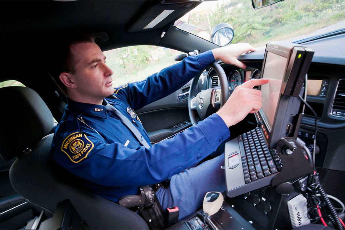 officer with police scanner