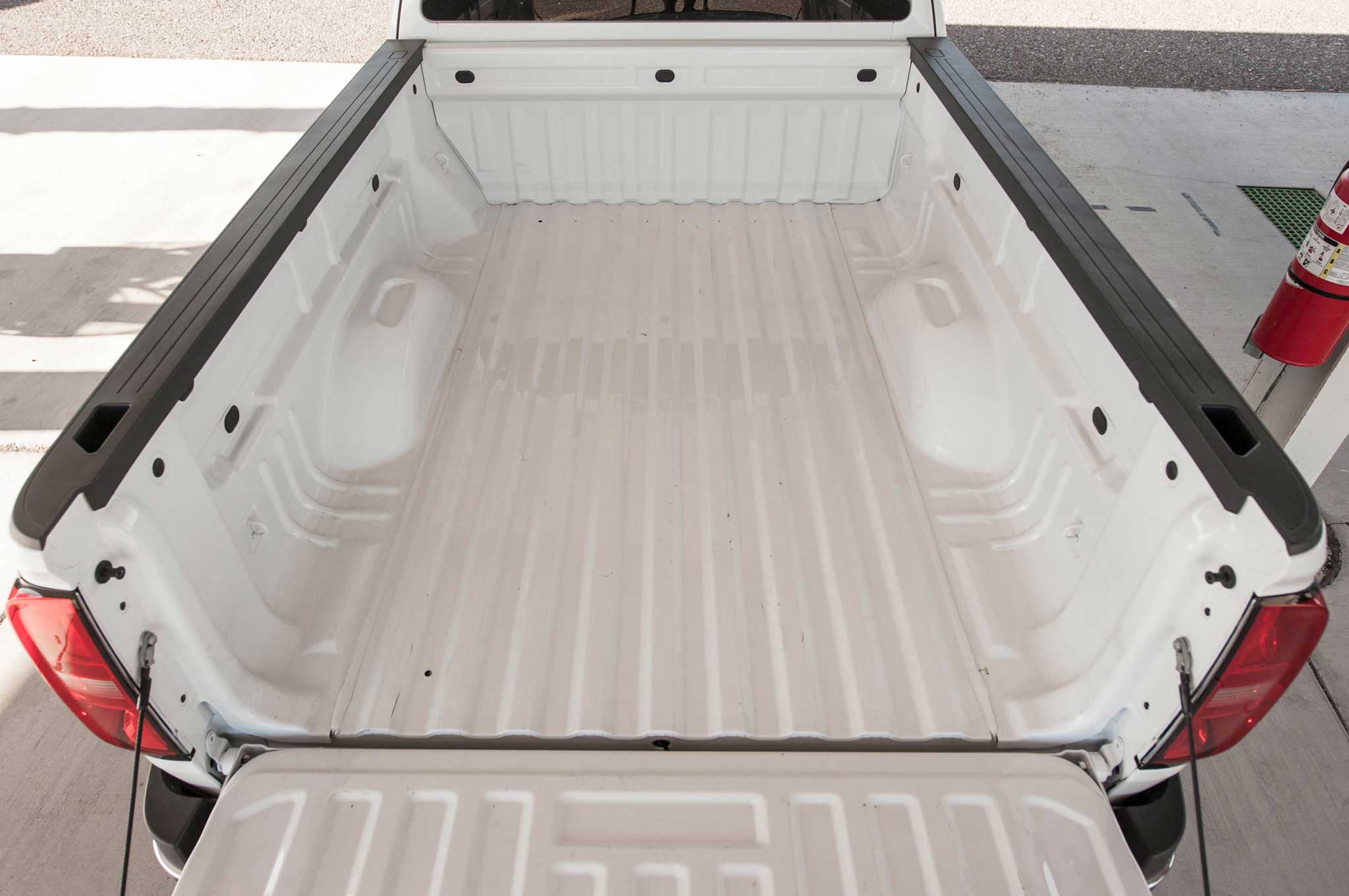 A photo of Chevy Colorado truck bed with a white bedliner