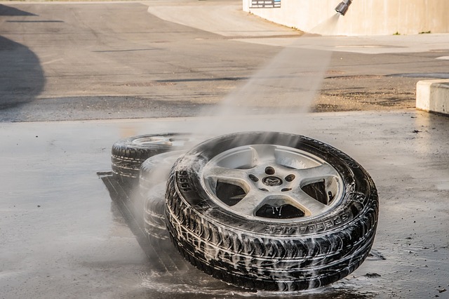 a car tire being hosed down