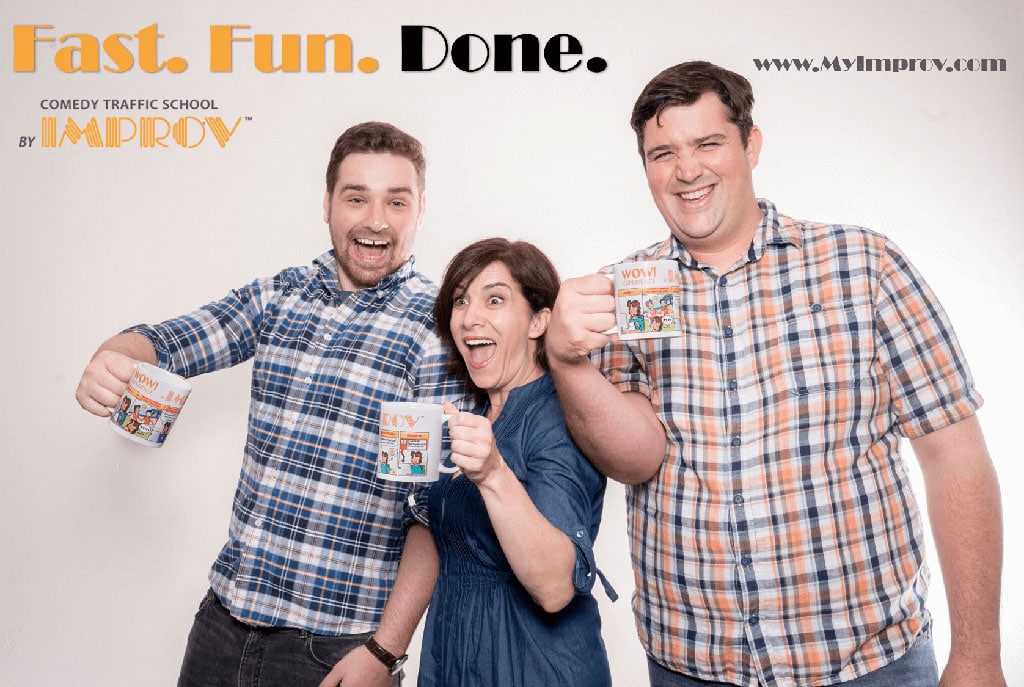 people smiling and holding improv cups