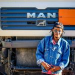 man standing in front of truck