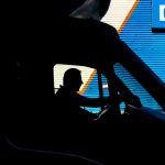 silhouette of a man driving a truck