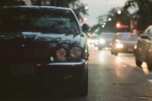 black car and other vehicles on the road
