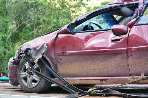 damage on a red car that crashed