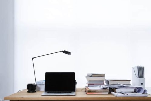 laptop and books on table