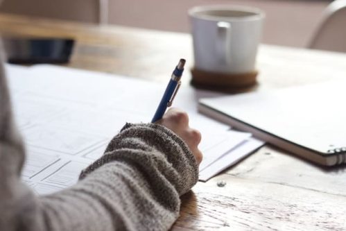 making notes on sheets of paper