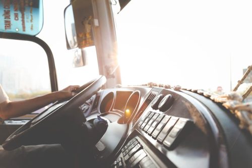person's hand on steering wheel