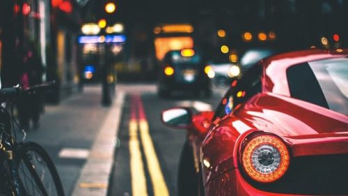 red sports car on the road