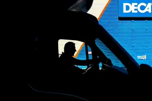 silhouette of a man driving a truck