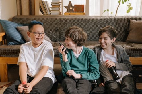 three friends having fun with radio